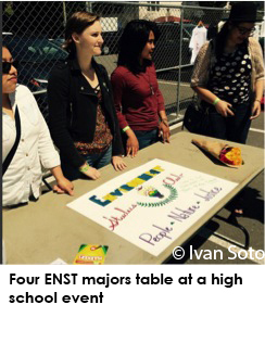 Four ENST majors table at a high school event